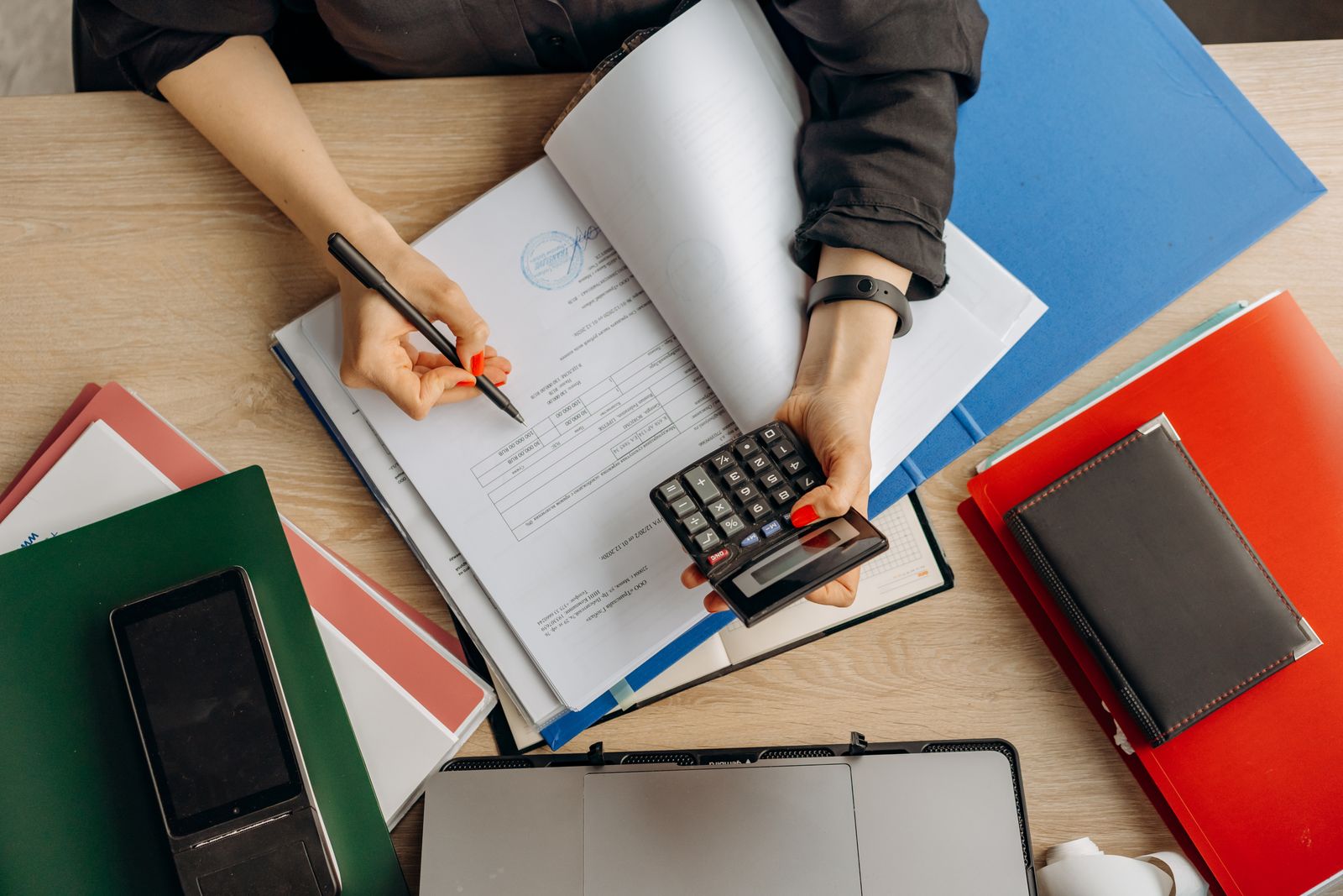Reviewing a vesting schedule and compensation documents on a laptop